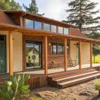 farmworker housing unit with walk up steps to a porch to sliding doors and clerestory windows